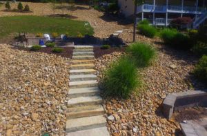 Stone steps make natural landscaping transitions for steep yards with hills.
