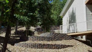 Use terraces and retaining walls for landscaping ideas for hilly slope yard areas.