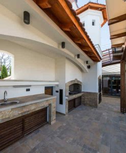 A sink in a modern outdoor kitchen