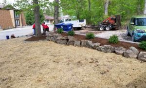 Heartland landscape crew working on a front yard landscape design at Lake of the Ozarks.