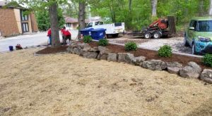 Heartland landscape crew working on a front yard landscape design at Lake of the Ozarks.